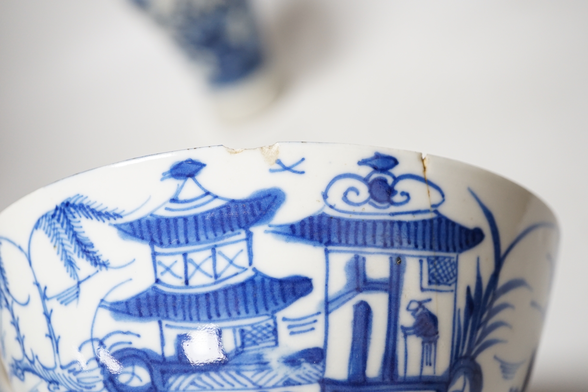 A Chinese blue and white bottle vase with figural decoration and two similar bowls, vase 17cm tall